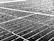 Close-up of a solar panel with water droplets after a professional cleaning service.