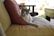 A cozy living room with a cat lounging comfortably on a soft couch.