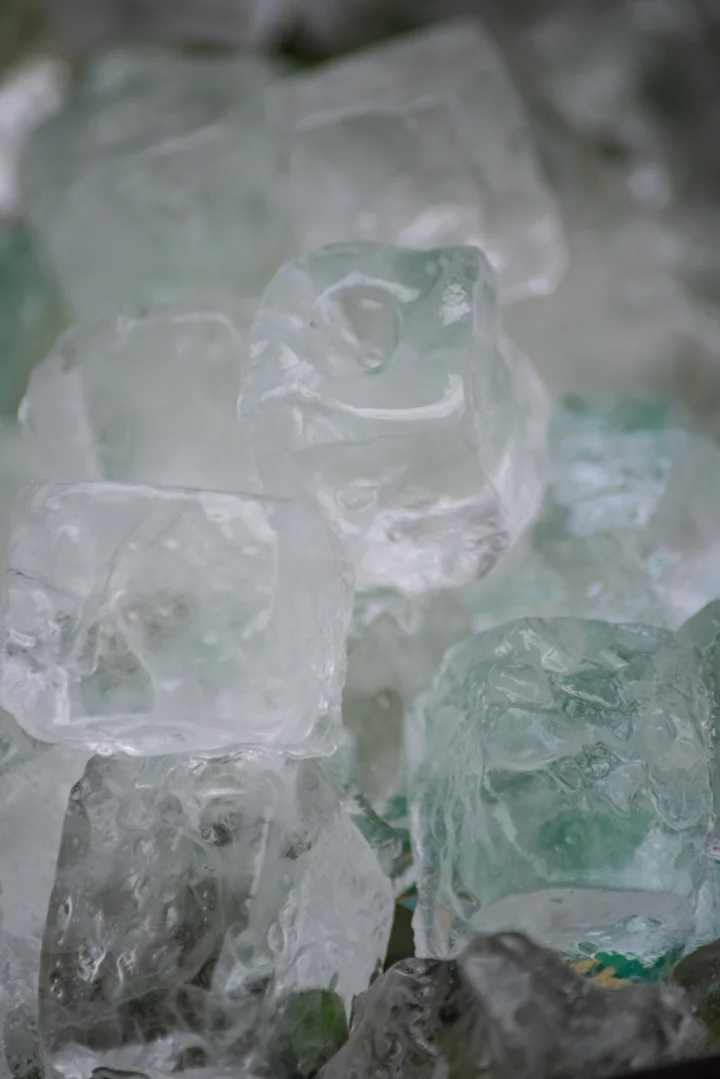 A pile of ice cubes sitting on top of a table