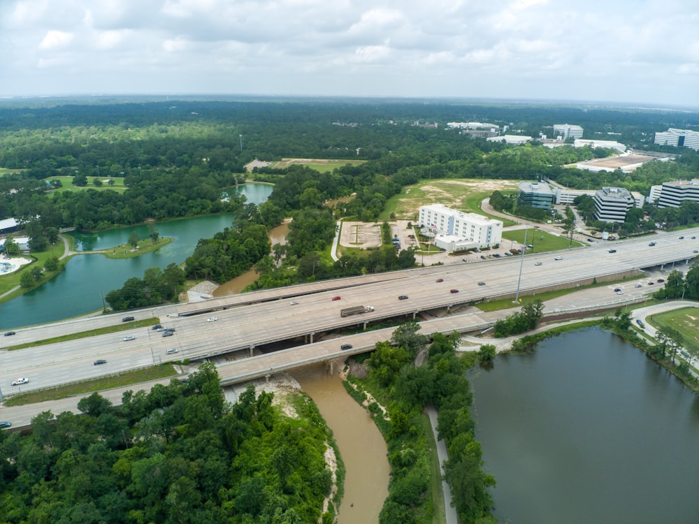 an aerial view of a highway and a river