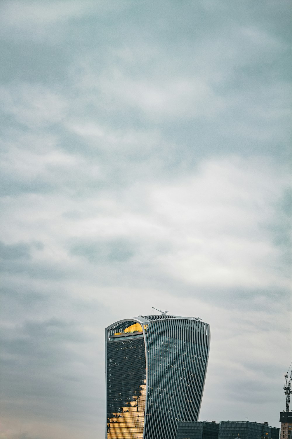 a very tall building with a sky background