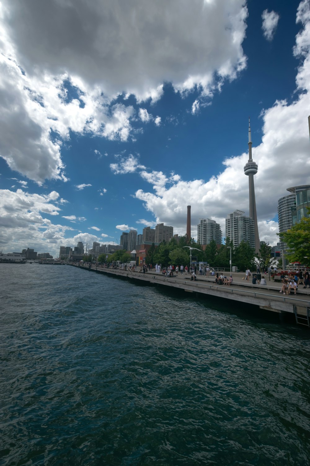 a body of water with a city in the background