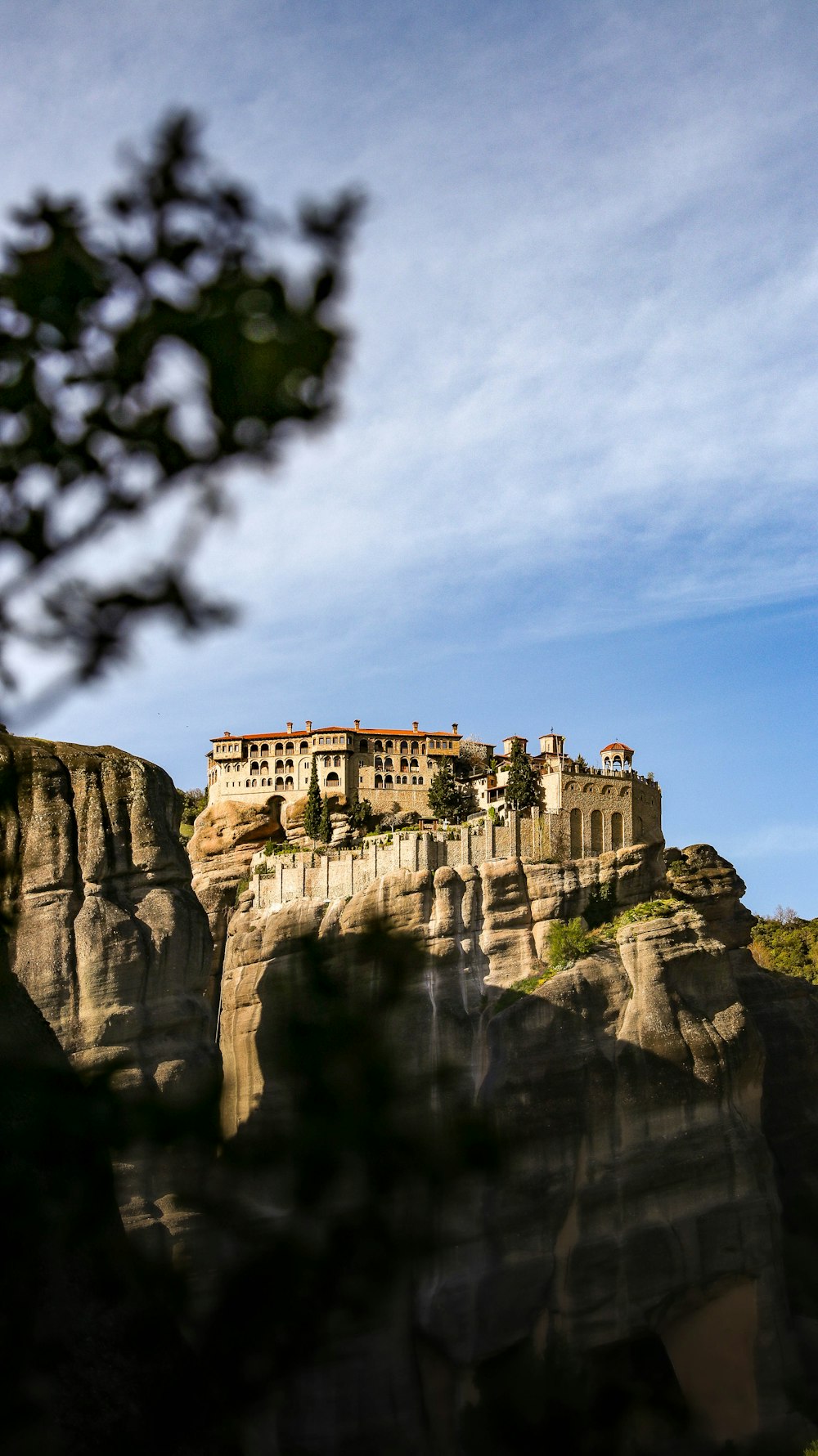 a castle perched on top of a cliff