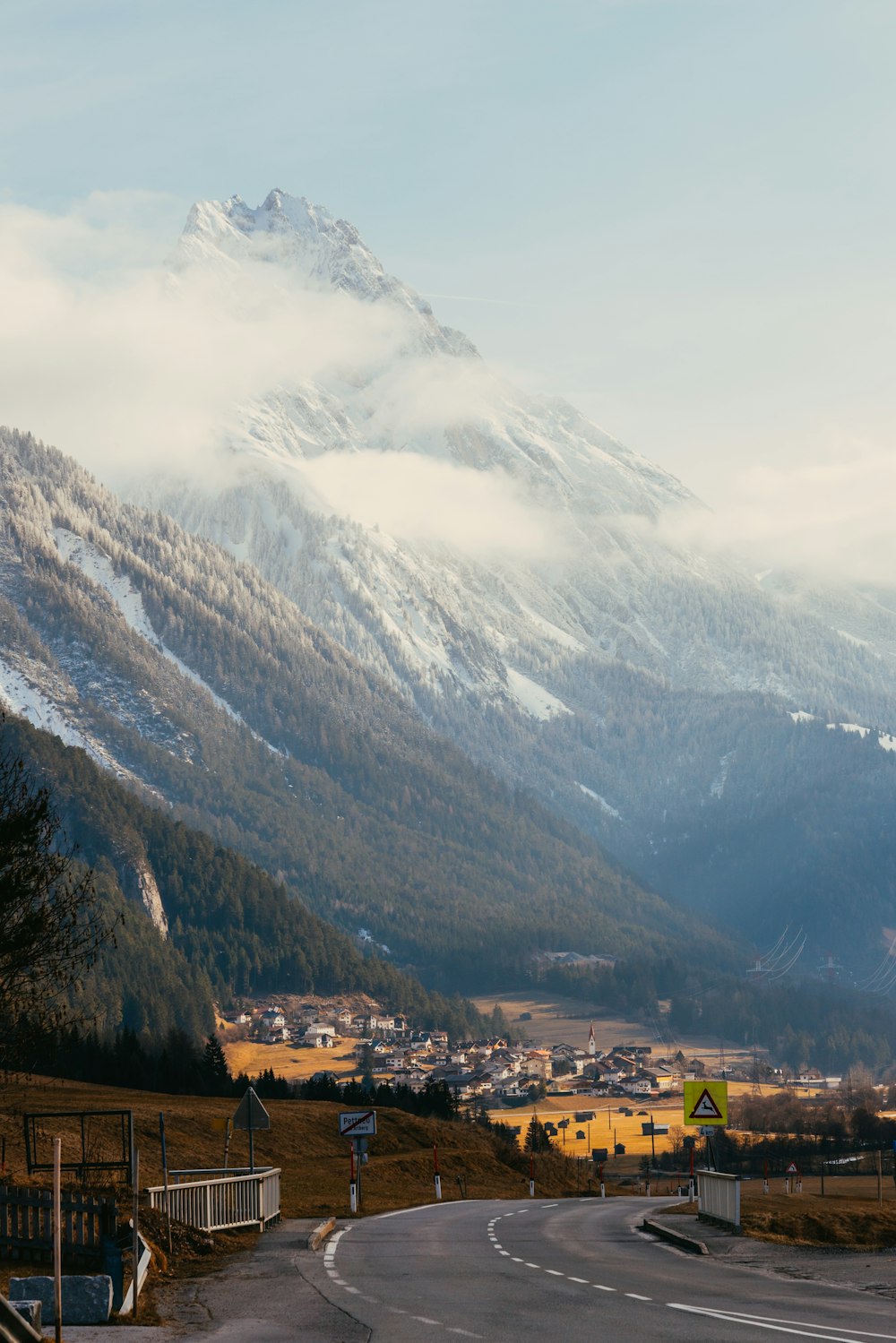 a road with a mountain in the background