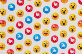a group of smiley face balloons on a white background