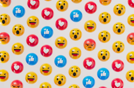 a group of smiley face balloons on a white background
