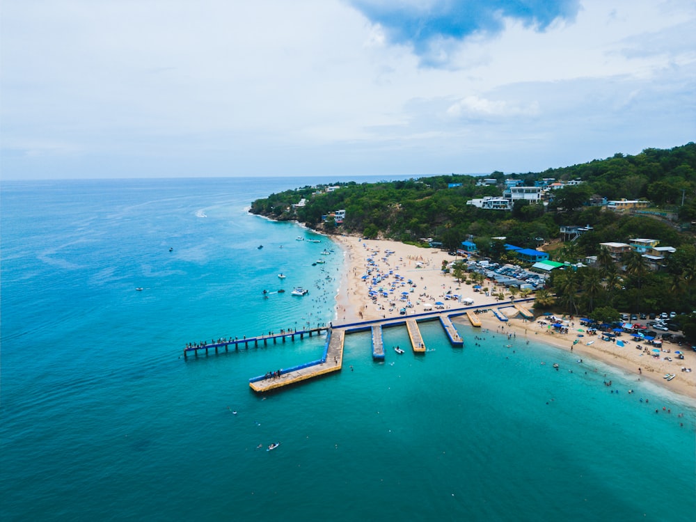 an aerial view of a beach and pier