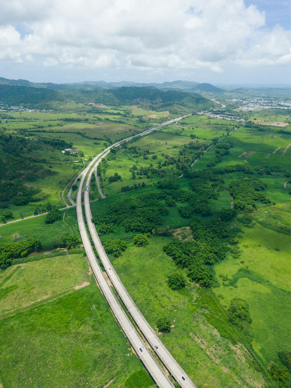 an aerial view of a highway in the country