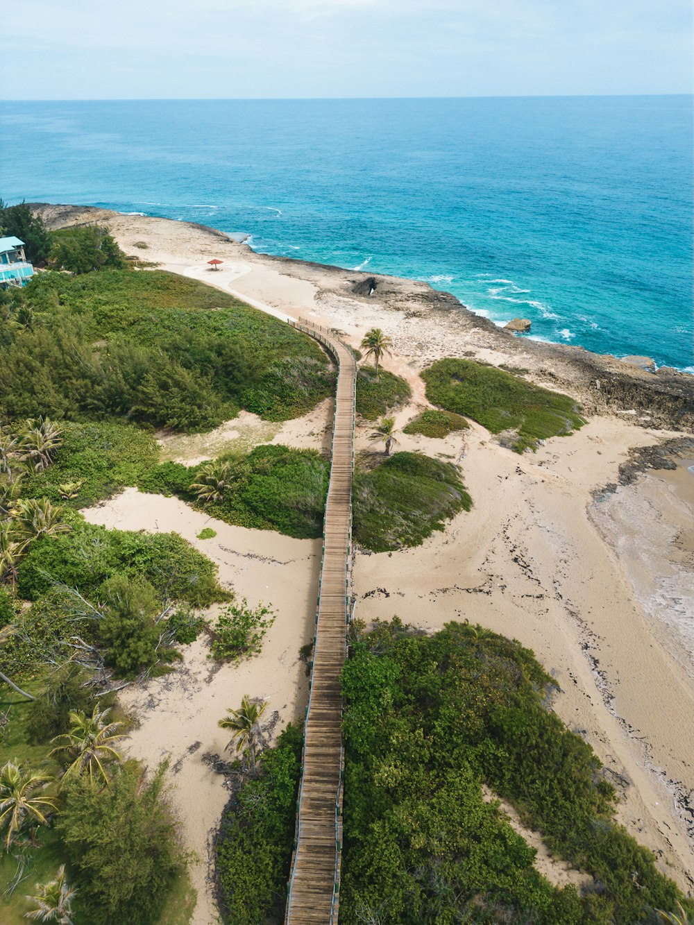 a wooden walkway leading down to the beach