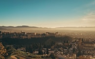 Panoramic shot of Cetatea Neamțului under a clear blue sky.