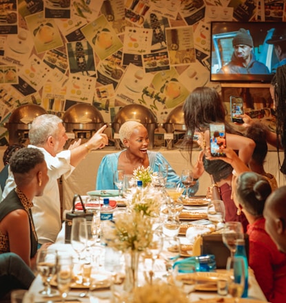 a group of people sitting around a table