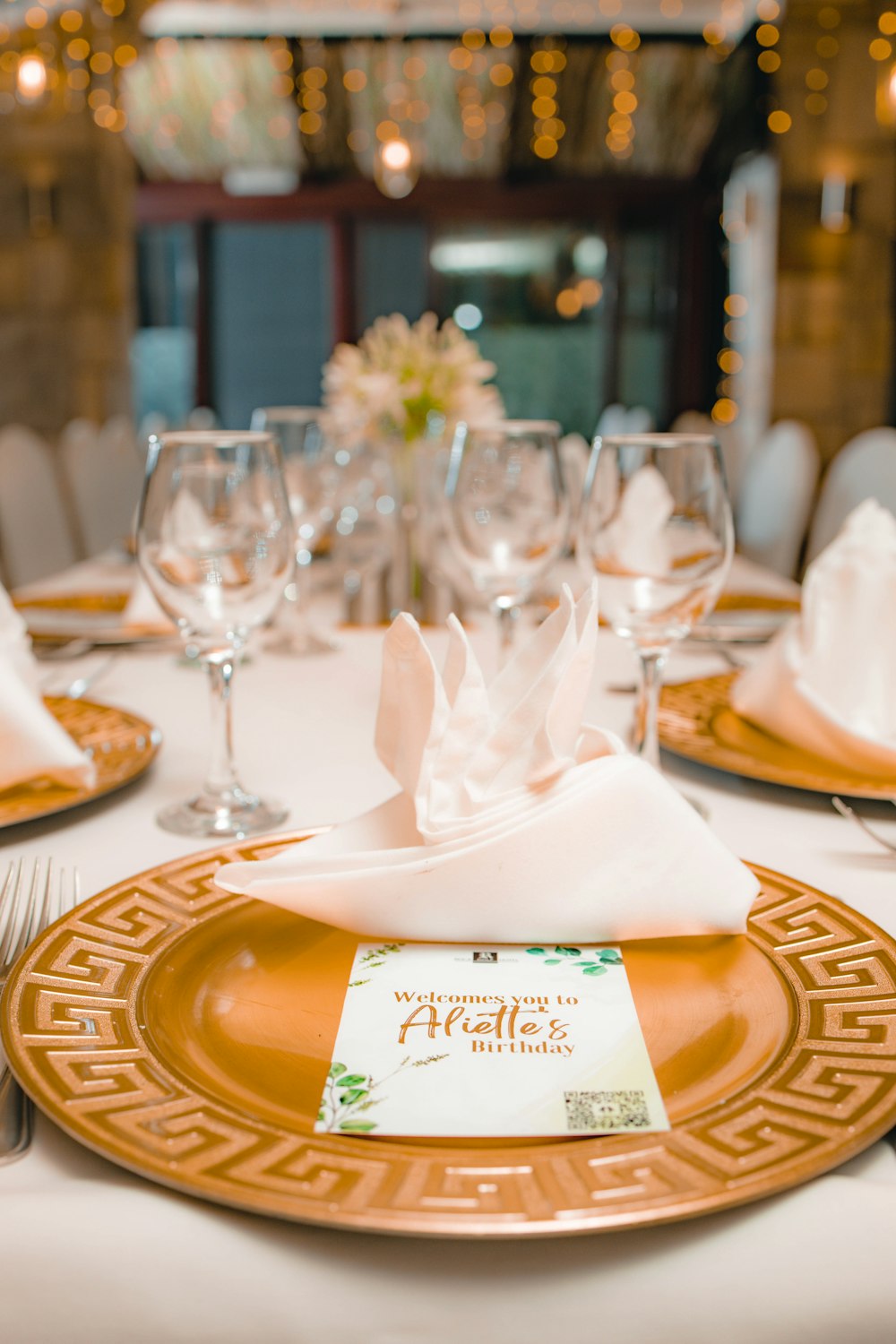 a table set for a formal dinner with place settings