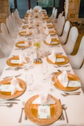 a long table set for a formal dinner