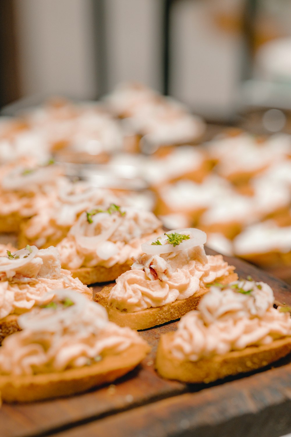 a wooden table topped with cookies covered in icing