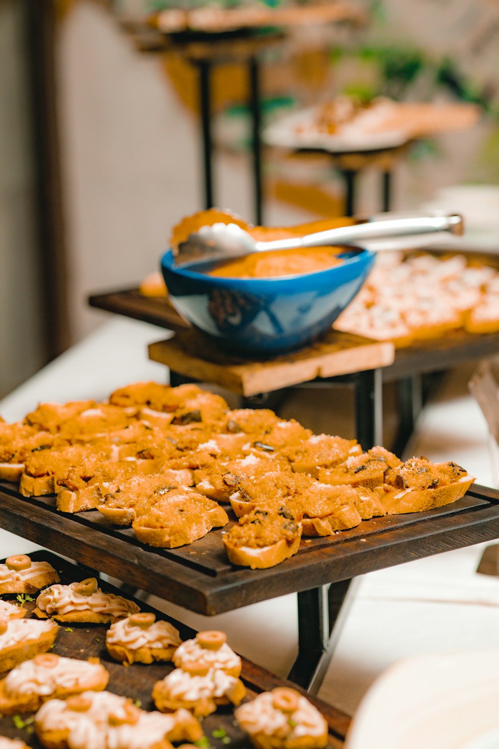 a table topped with lots of trays of food