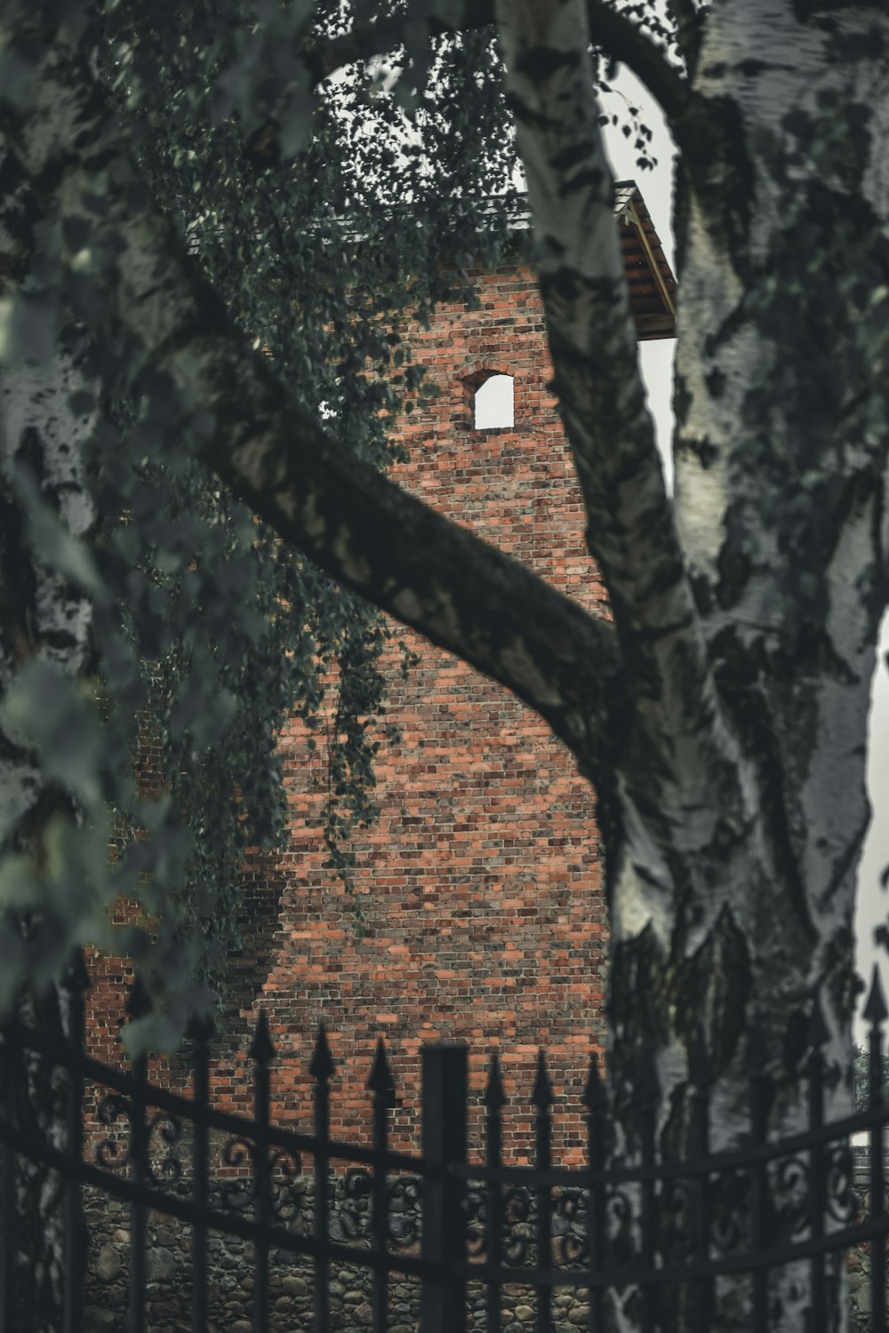 a brick building with a clock on the side of it