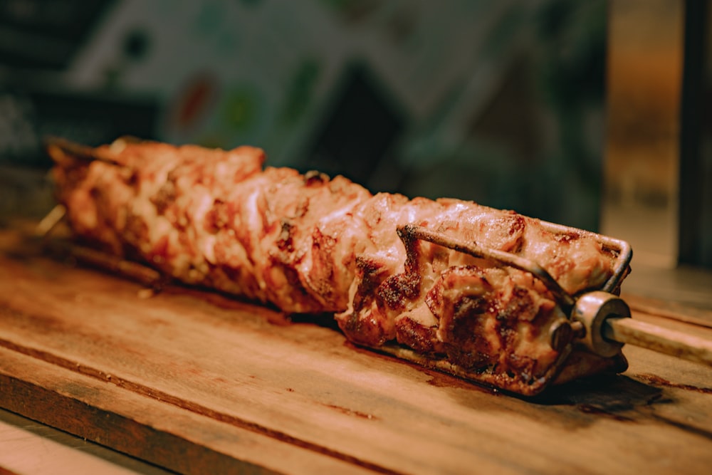 a piece of meat on a wooden cutting board