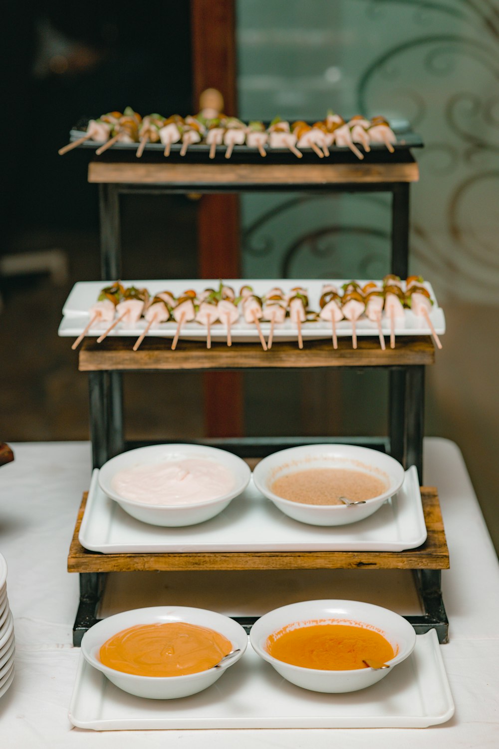 a white table topped with plates of food