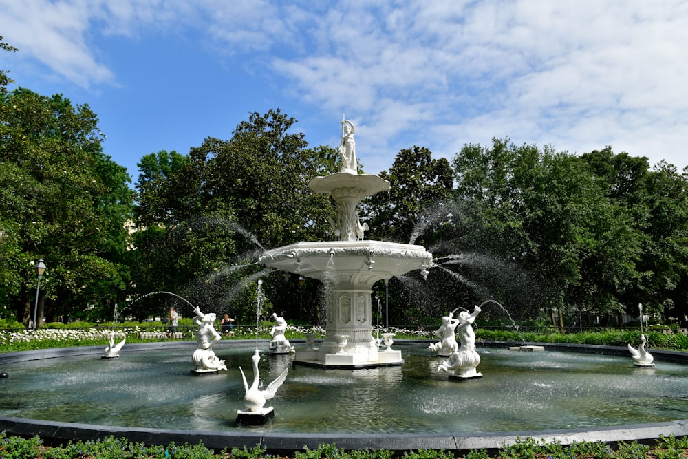 a water fountain with statues in the middle of it