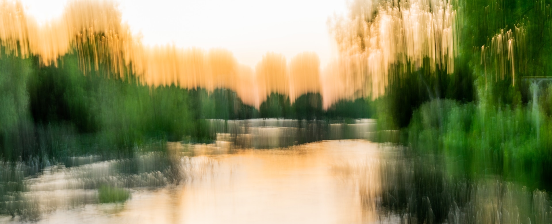 woman wearing yellow long-sleeved dress under white clouds and blue sky during daytime