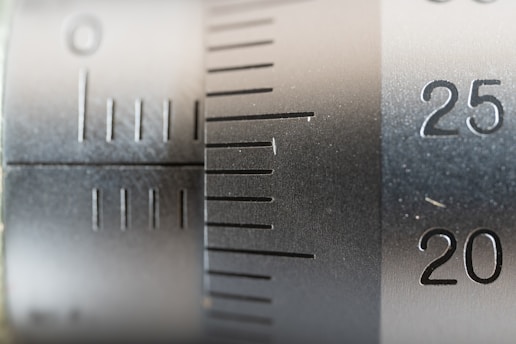 Close-up of a precision scale being calibrated in a professional metrology lab.