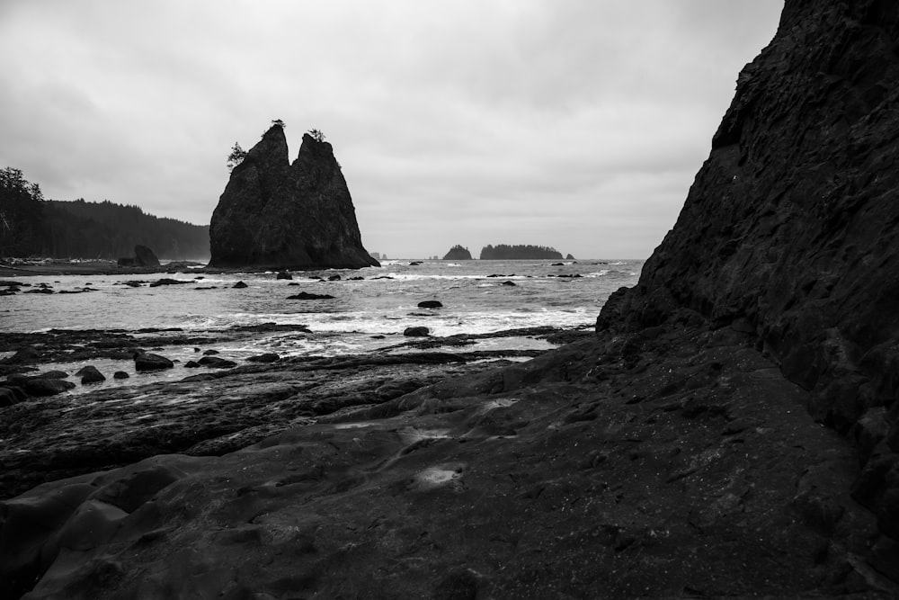 a black and white photo of a rocky beach
