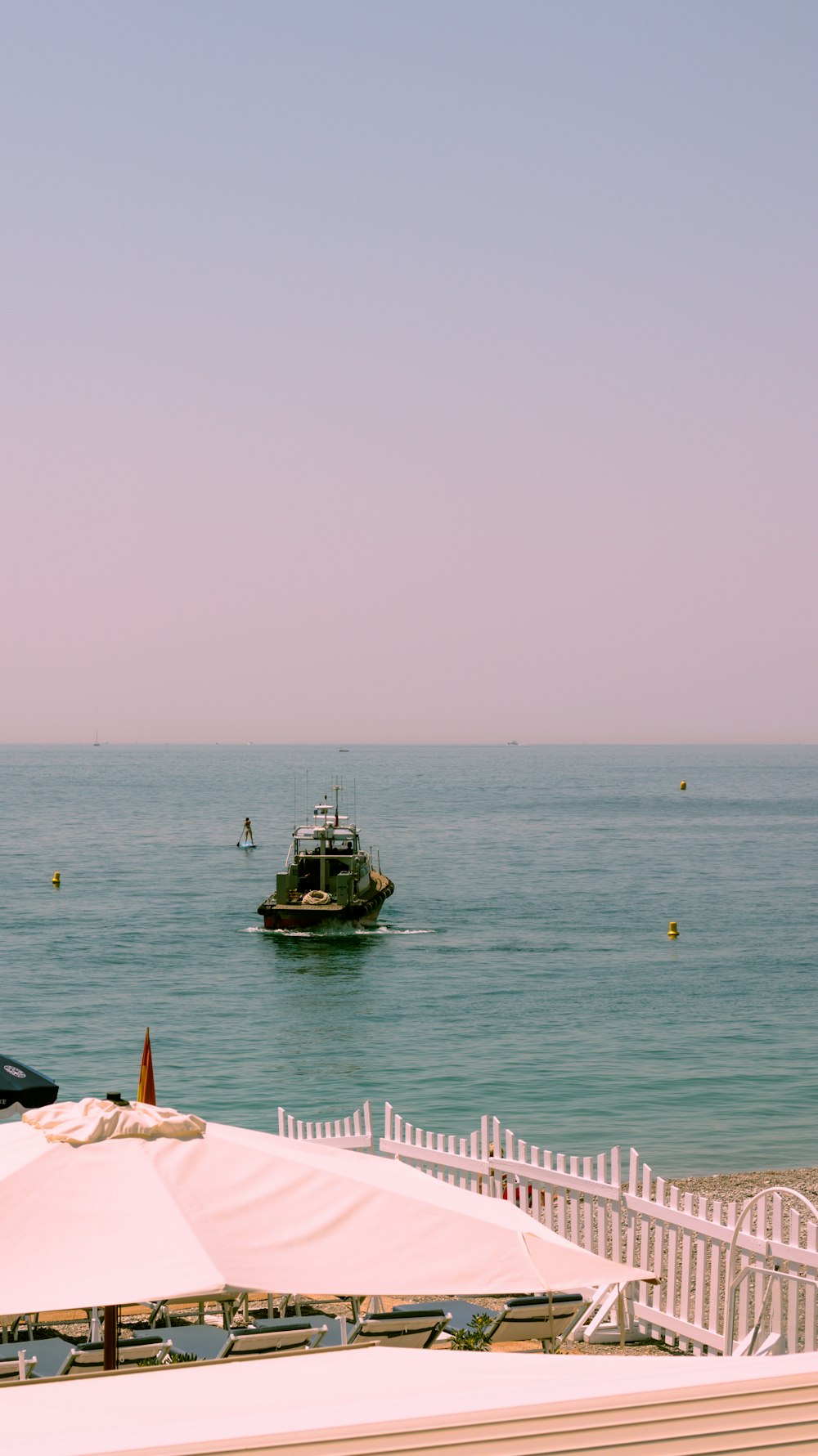 a boat is in the water near a beach