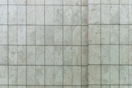 Close-up of tile flooring with grout lines highlighting the pattern and texture.