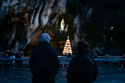 A quiet moment of prayer with candles glowing softly around the altar.
