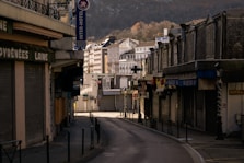 a city street with a mountain in the background