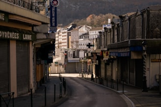 a city street with a mountain in the background
