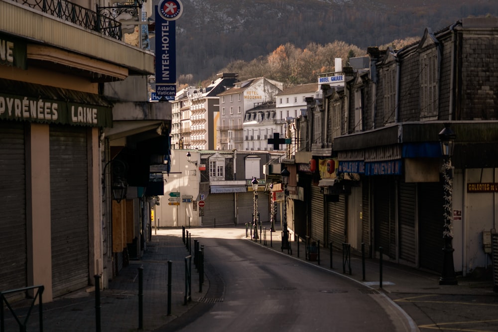 a city street with a mountain in the background