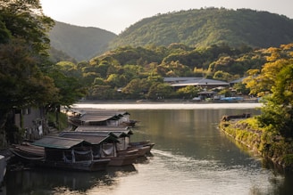 a group of boats floating on top of a river