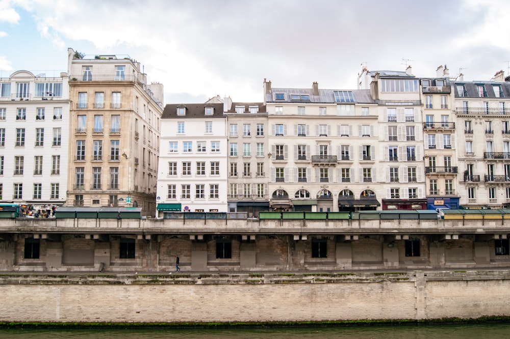 a group of buildings next to a body of water