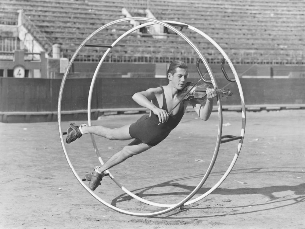 a man is doing tricks in a hoop