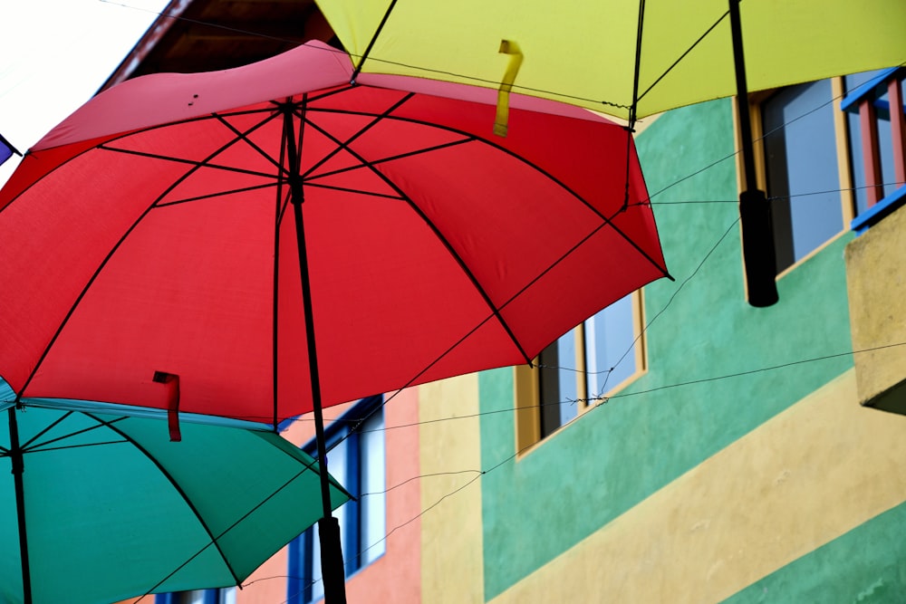 a group of umbrellas hanging from a building