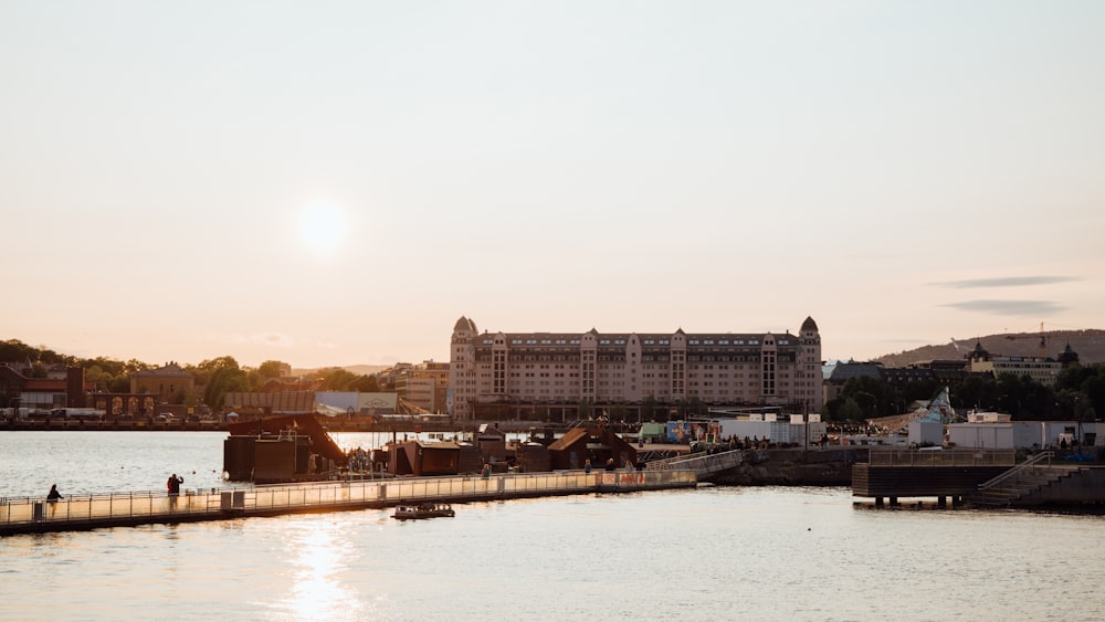 a large body of water with buildings in the background