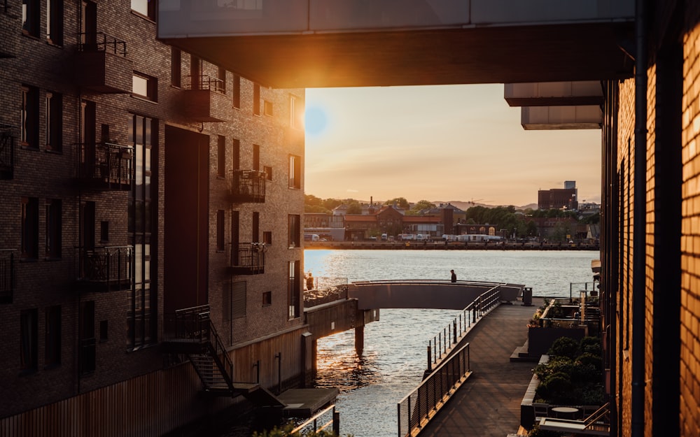 the sun is setting over a body of water