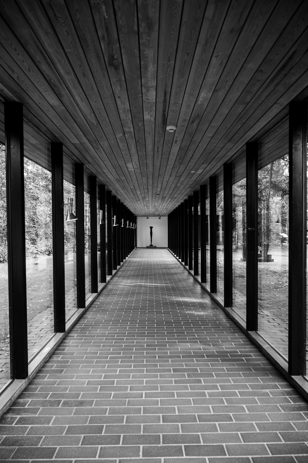 a black and white photo of a walkway