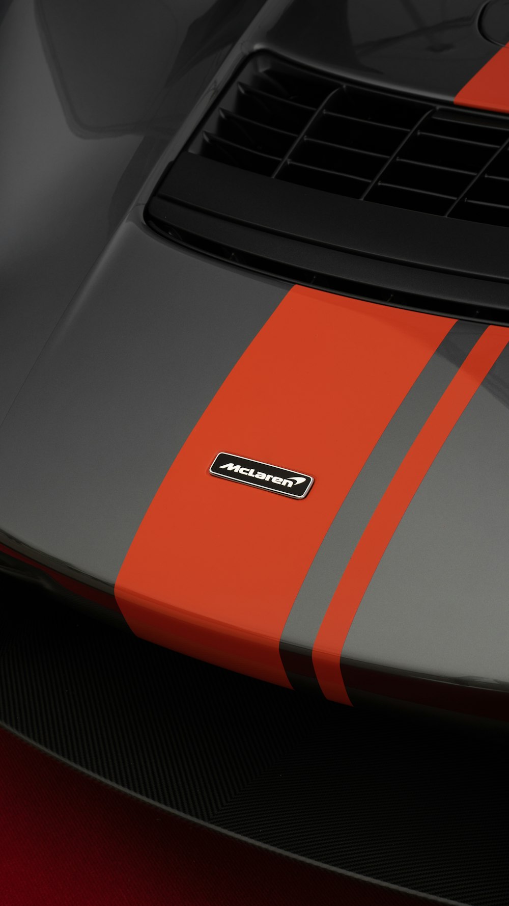 a close up of the hood of a sports car