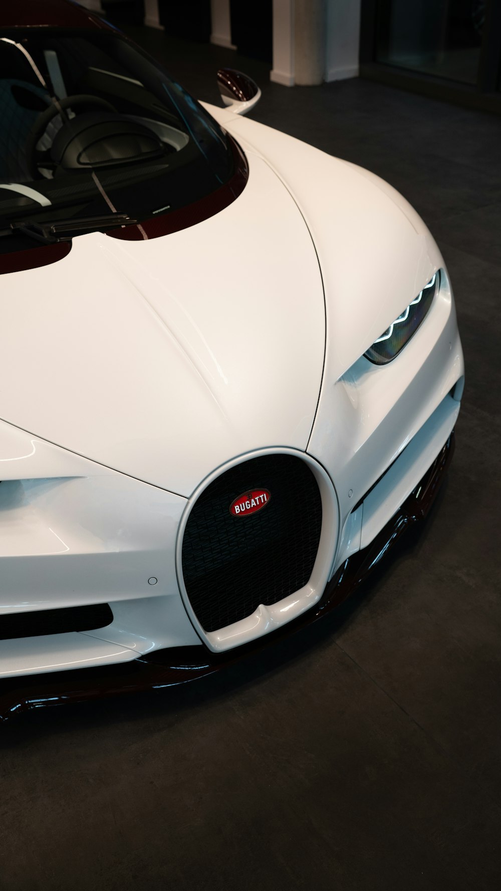 a white sports car parked in a garage