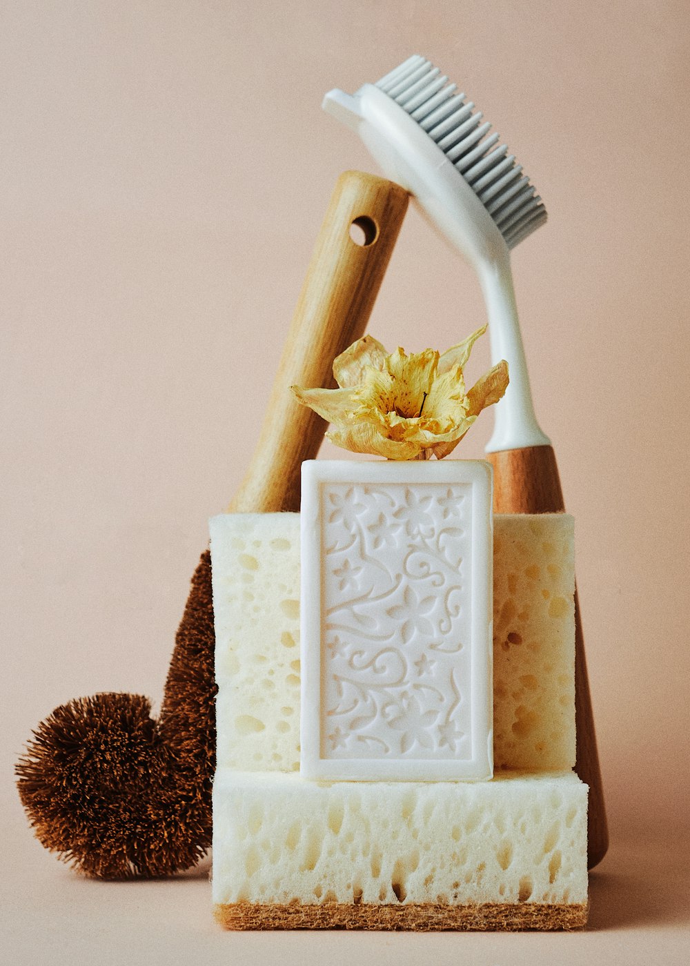 a toothbrush, comb, and soap on a table