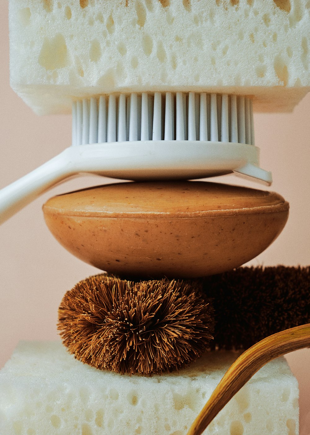 a pile of different types of hair brushes on top of each other