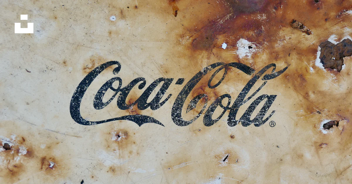 A close up of a coca cola sign on a wall photo – Free Rust Image on ...