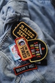 a close up of a jacket with patches on it