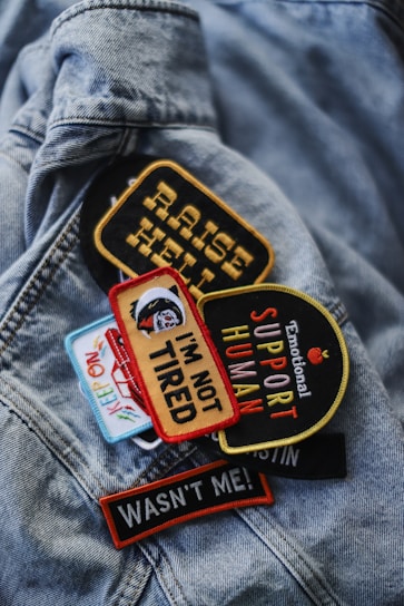 a close up of a jacket with patches on it