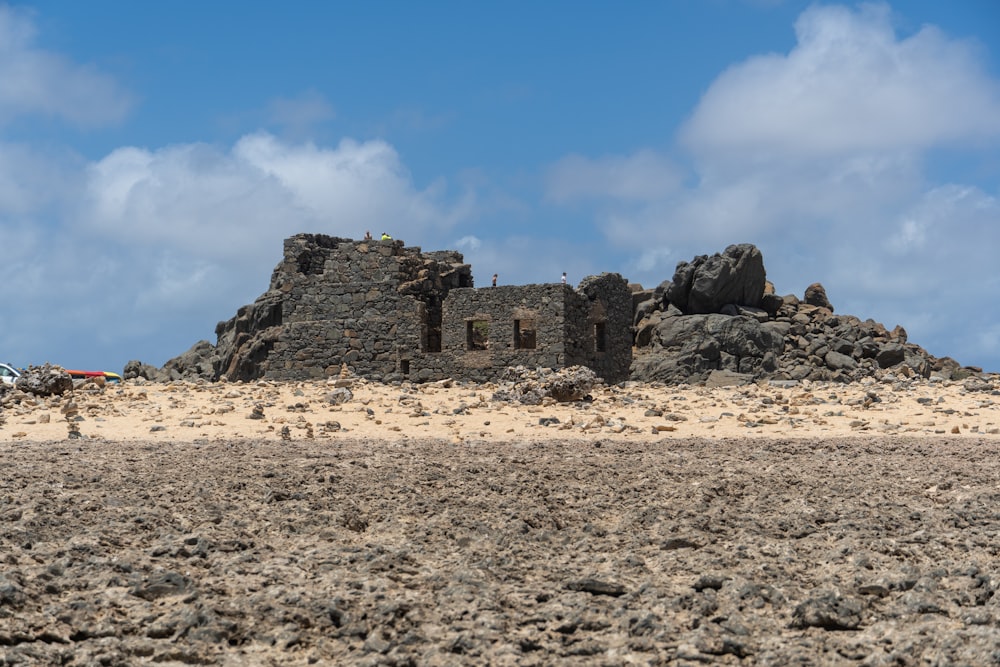 an old building in the middle of a desert