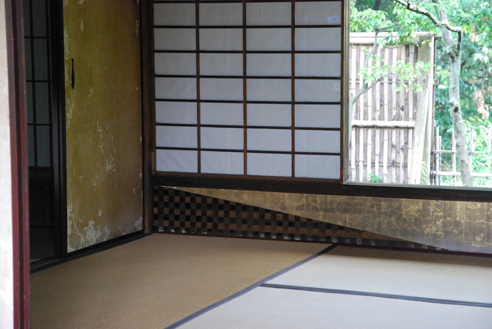 a room with a door and a rug on the floor