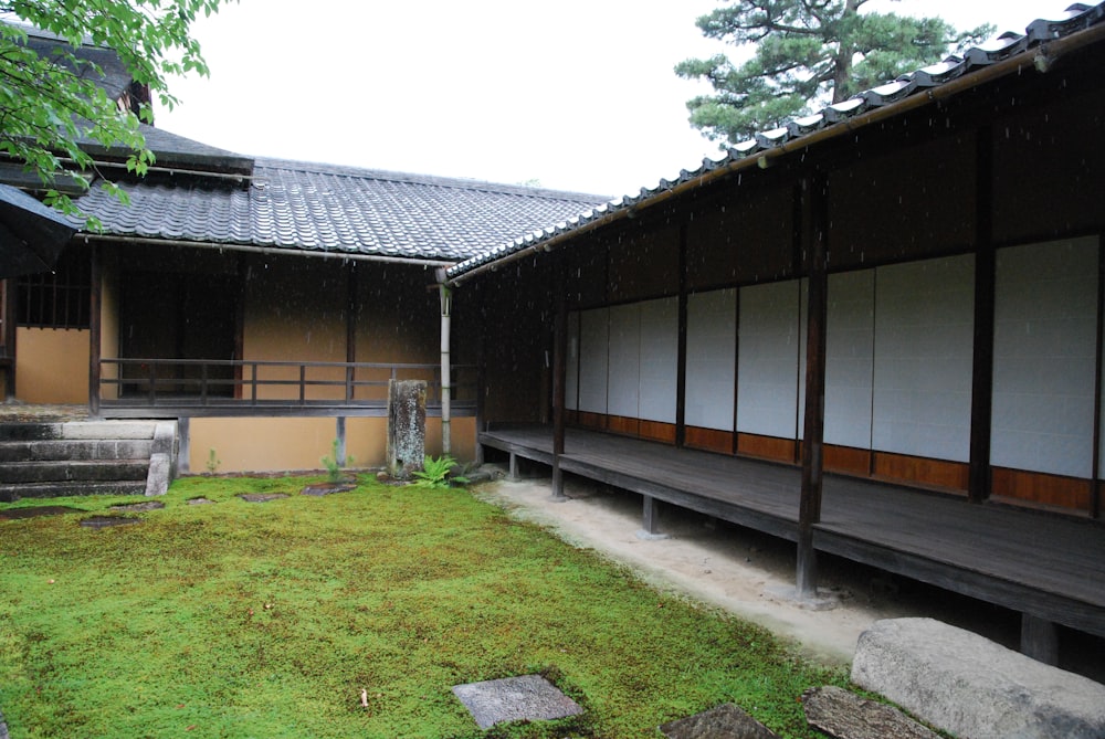 a building with a grass lawn in front of it