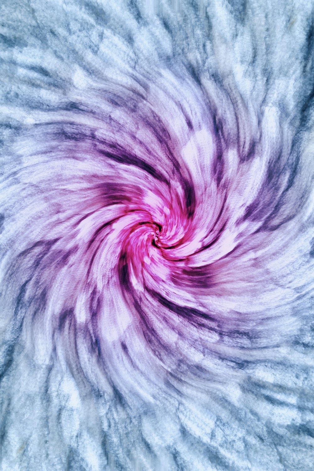 a purple and white swirl in the middle of a picture